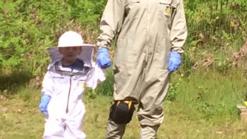 Out in the field with 3 yr old grandson